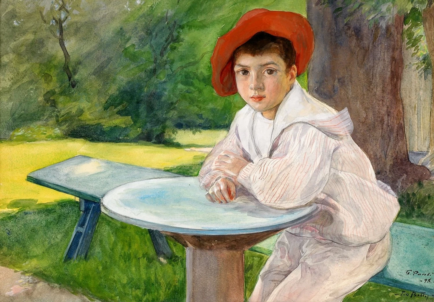 Ragazzo a tavola in giardino